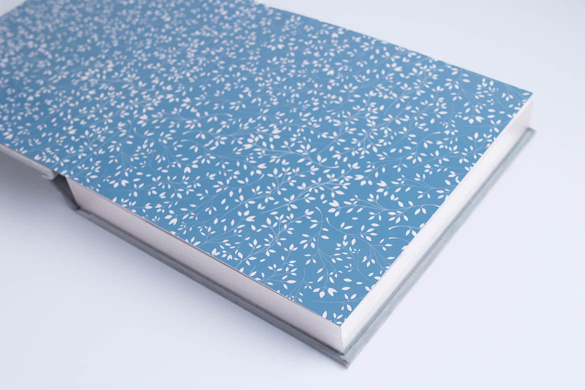 wedding album with End page with small white leafs on blue background