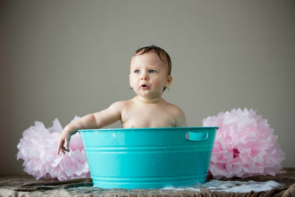 one year old talking in the bath