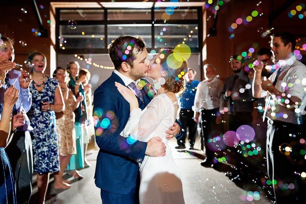 bride and groom grand exit creative picture with soap bubbles