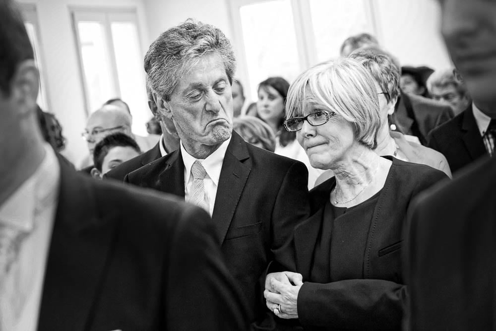 candid shot of parents during wedding ceremony black and white image