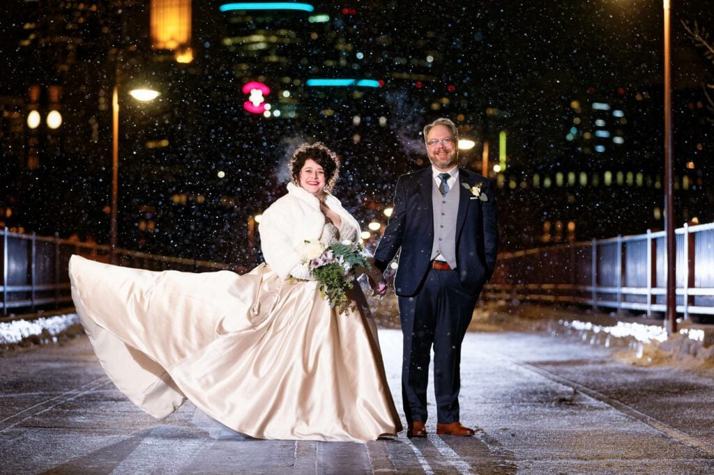 bride-and-groom-snowfall-on-stone-arch-bridge-1