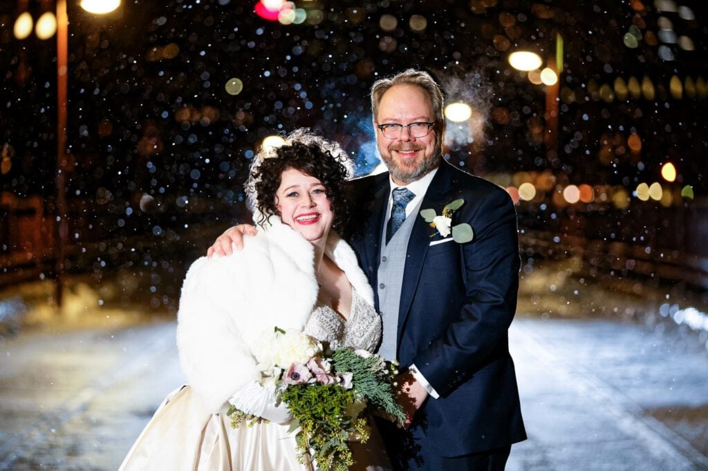 bride-and-groom-snowfall-on-stone-arch-bridge-2