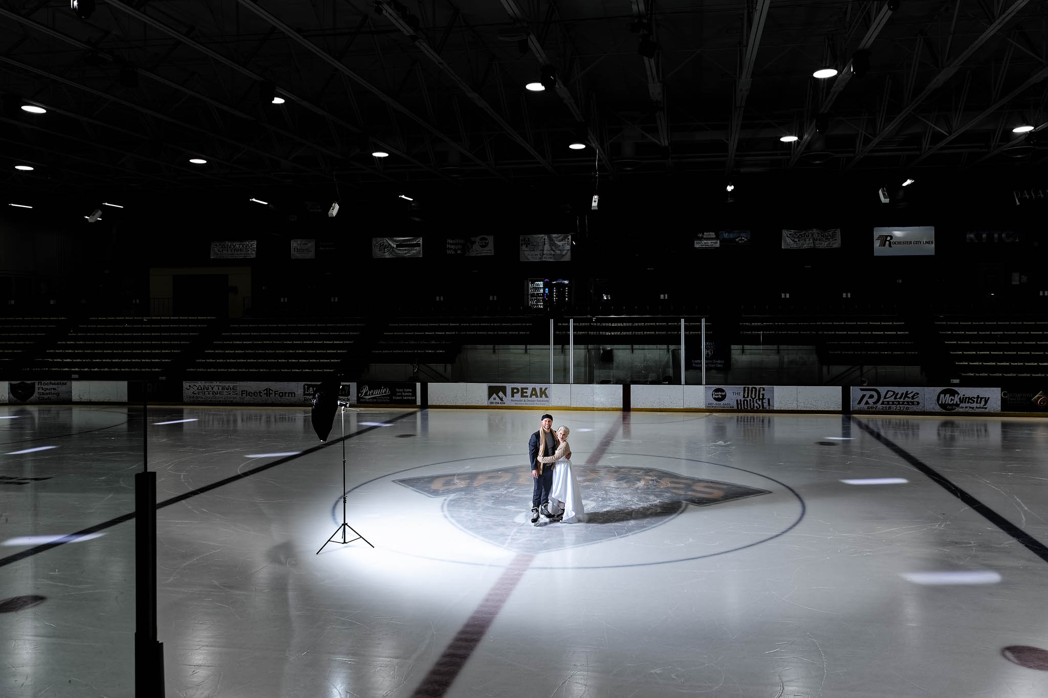 Bride andg room at rochester recreation center ice ring