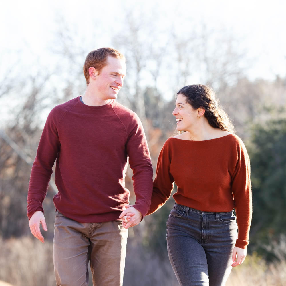 Couple dressed in analogues warm tones