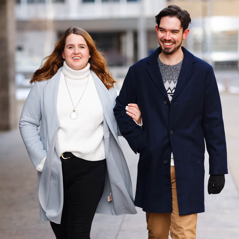 Couple dressed in complementary tones and felt coat