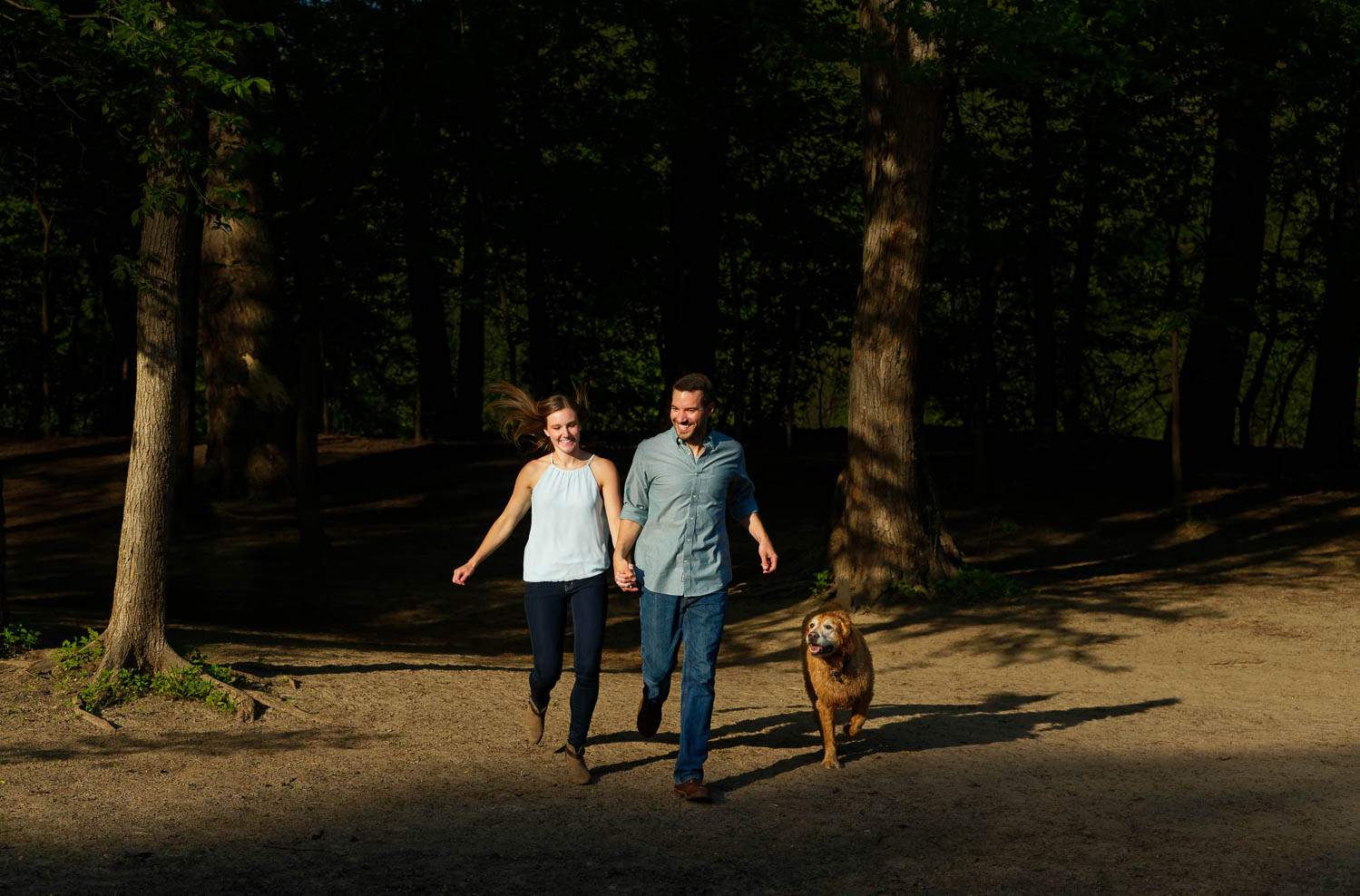 couple running with dog