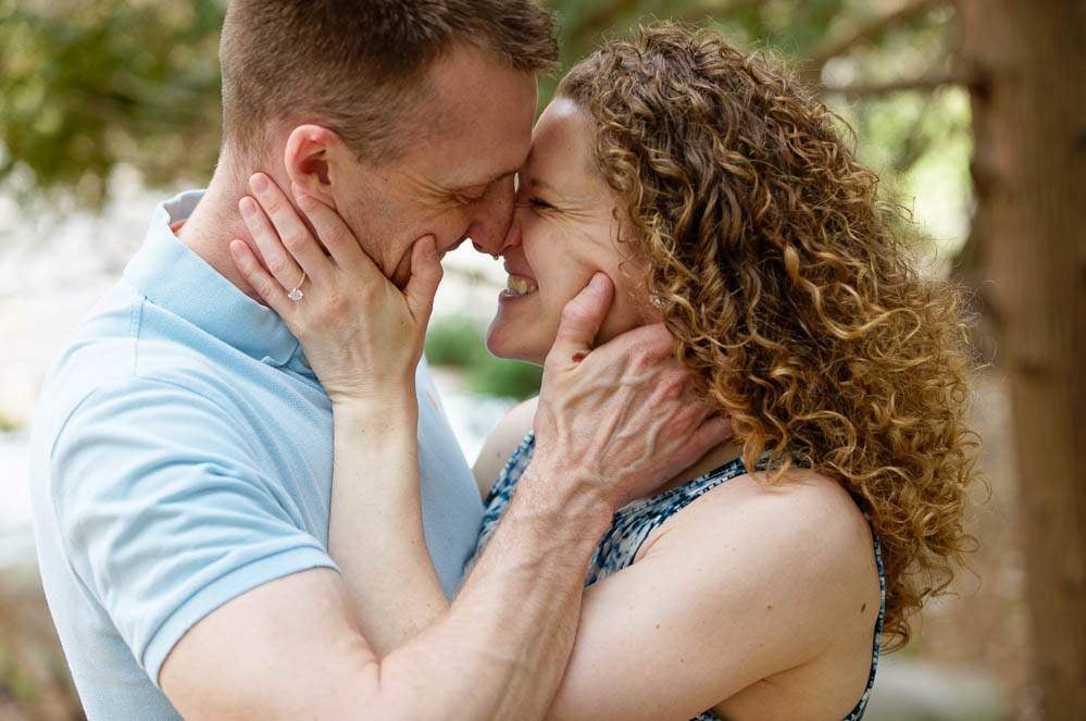 — couple in love kissing at minnesota landscape arboretum —