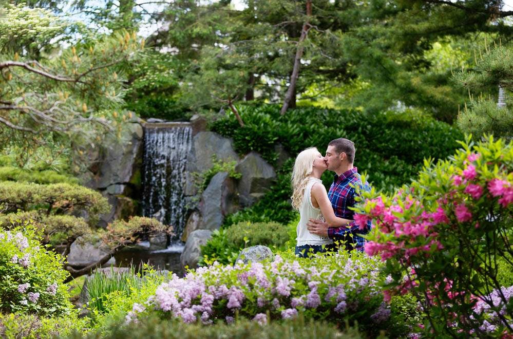 — lover kissing with waterfall in the background —