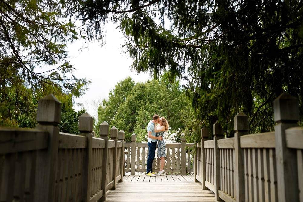 picture perfect of couple kissing on the wood aisle