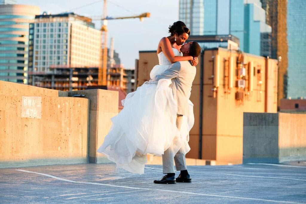 brie and groom on rooftop during sunset