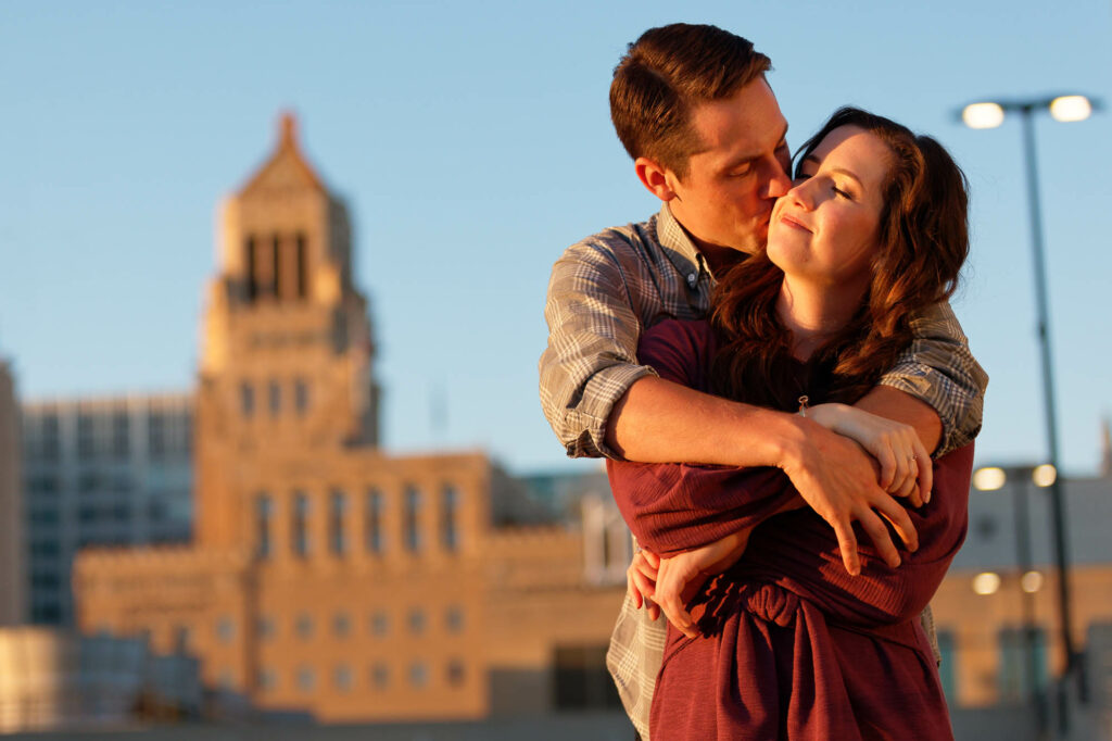 couple hugging in front of Plummer Building