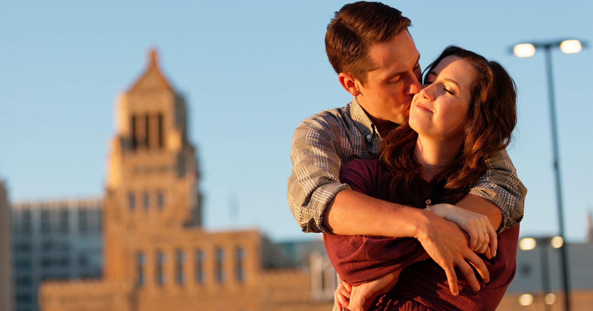 cropped-couple-hugging-in-front-of-plummer-building.jpg