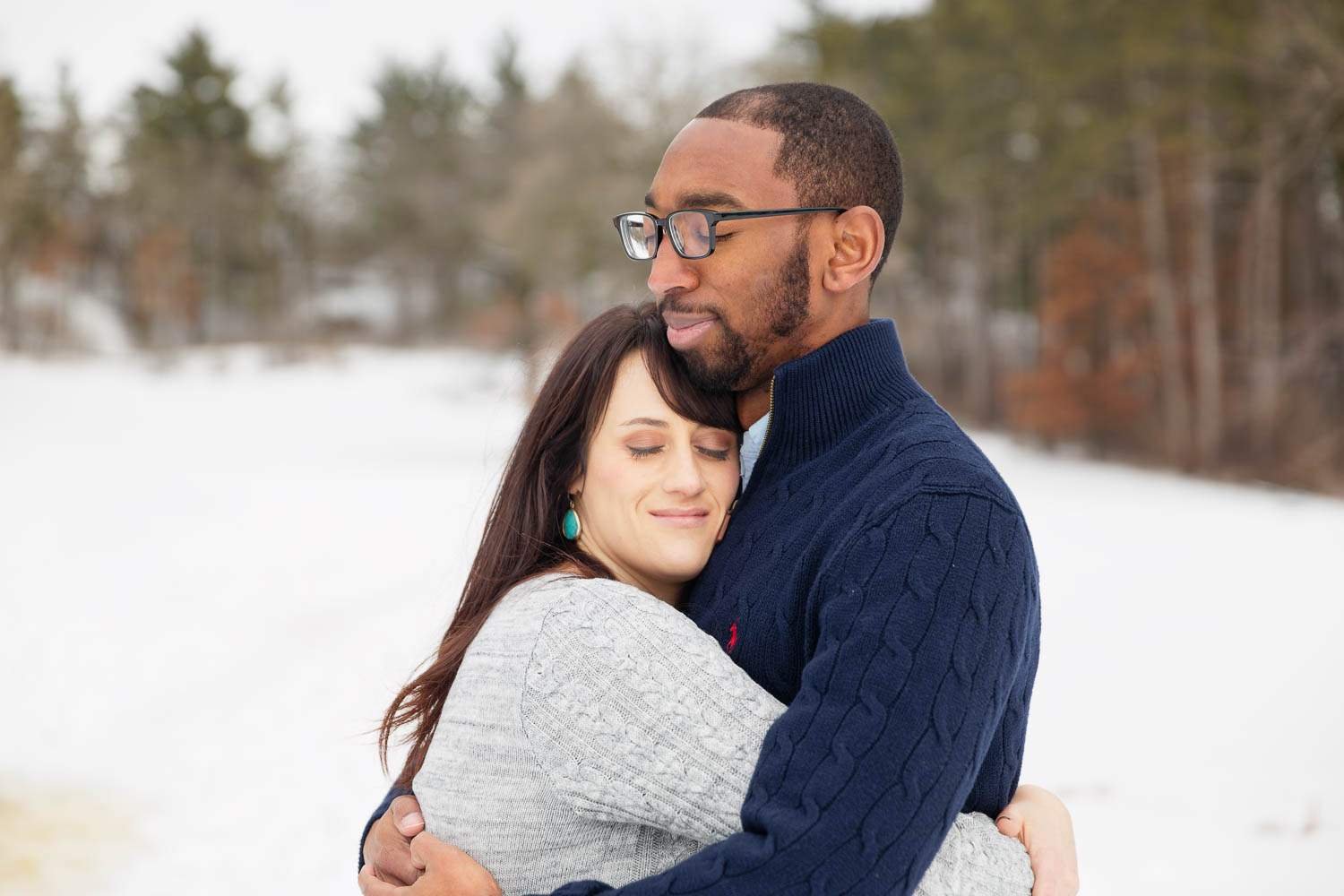 Bride to be and groom to be hugging