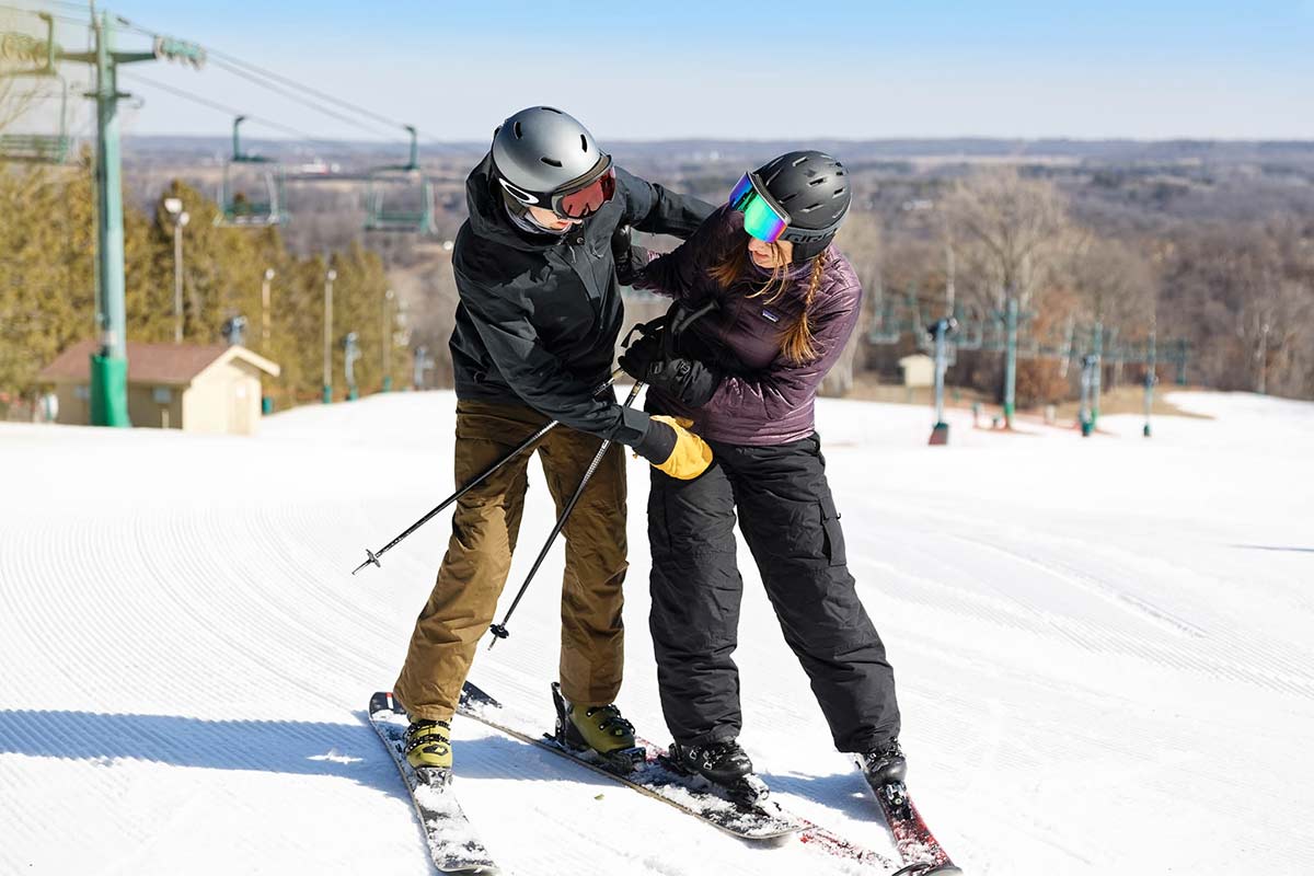 couple-on-ski-tickling-each-other