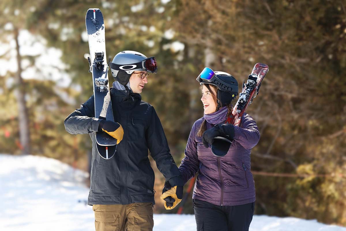 couple-walking-holding-hands-with-ski-gear