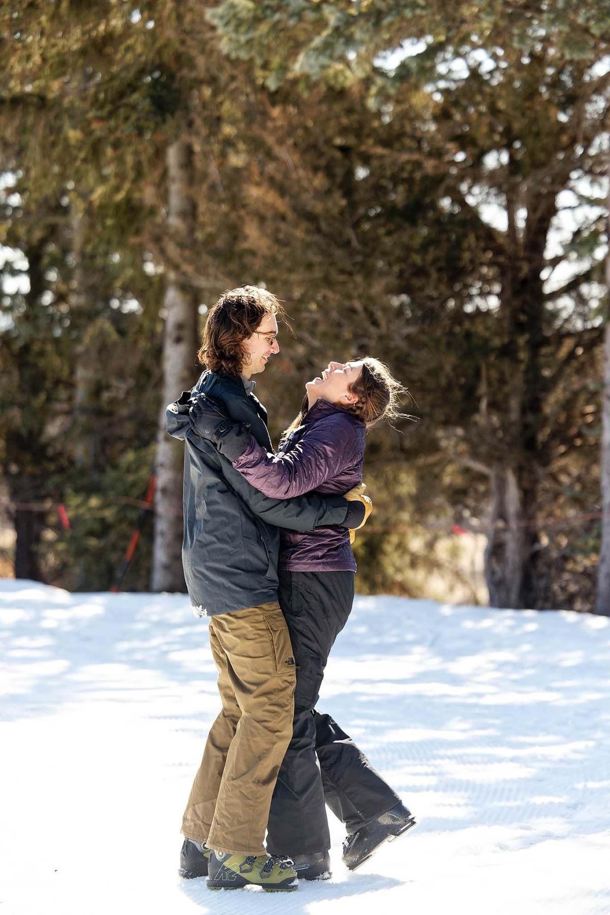 ski couple laughing