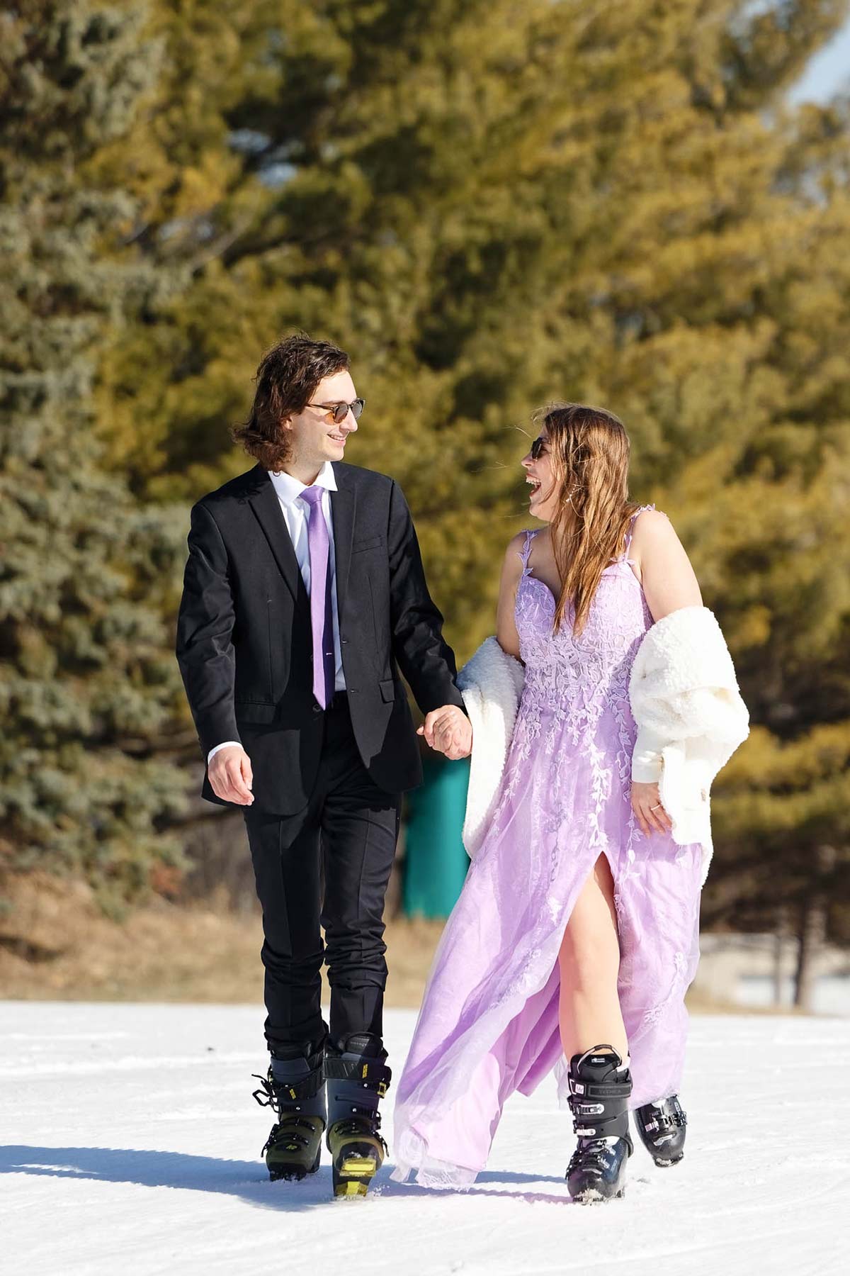 ski-engagement-session-couple-walking-in-the-snow