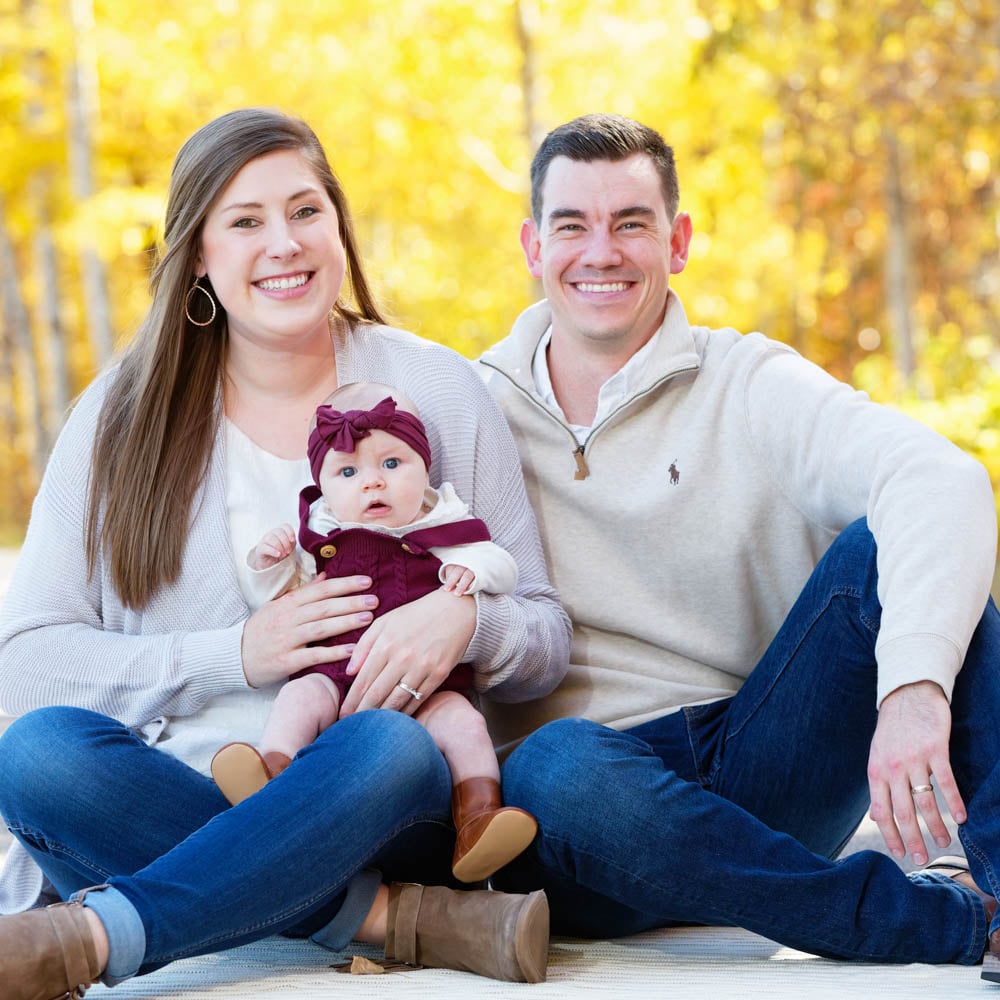 family sesison with burungdy accent on the baby