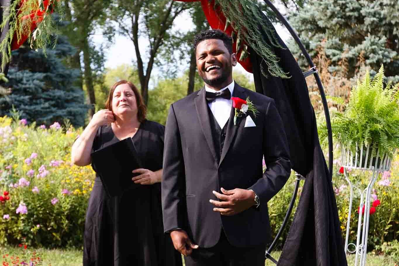 groom laughting during ceremony
