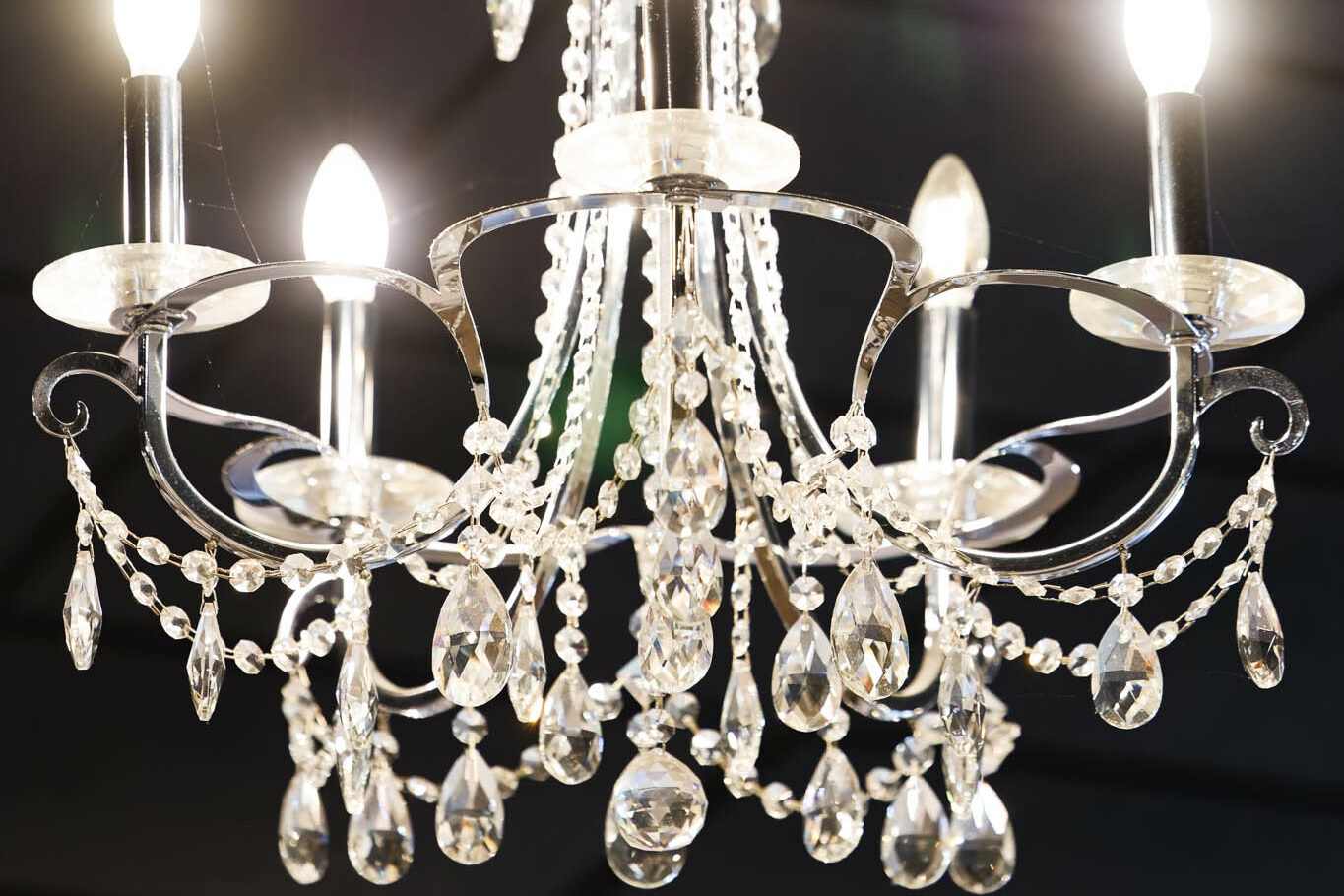 joy ridge event center - chandelier black ceilling