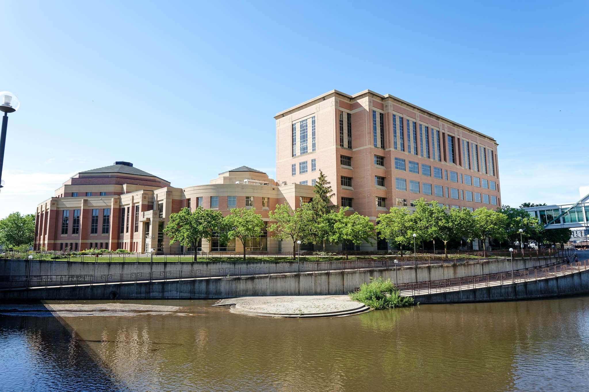 back of the Olmsted County Government Center with outdoor ceremony space and zumbro river