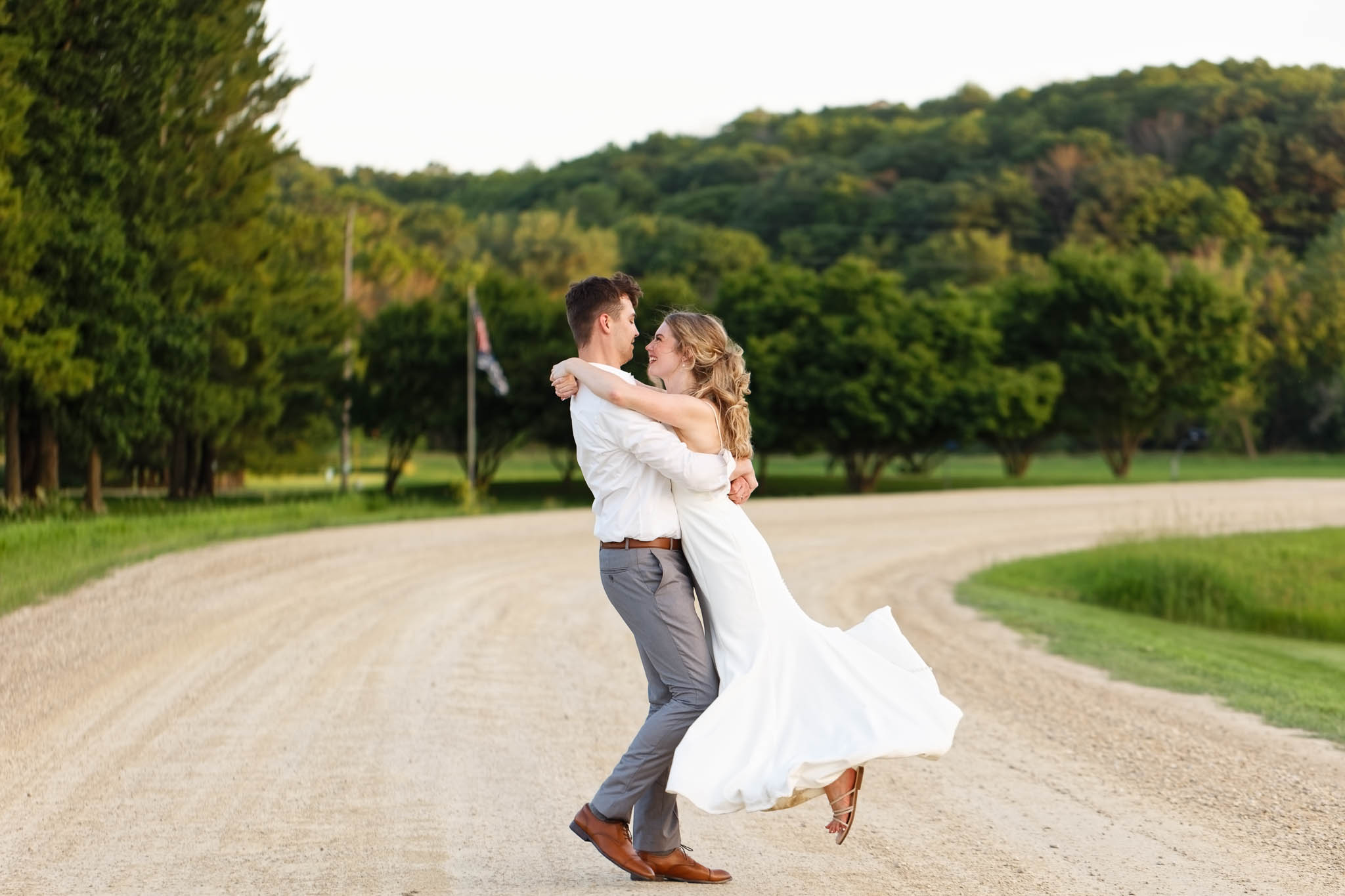 bride and groom on dirt road
