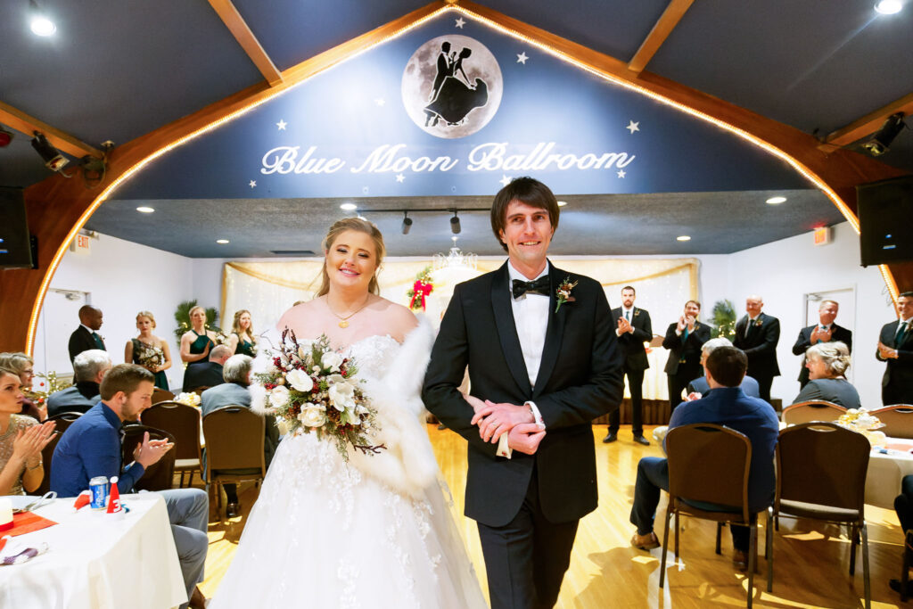 bride and groom getting married at Blue Moon Ballroom Rochester