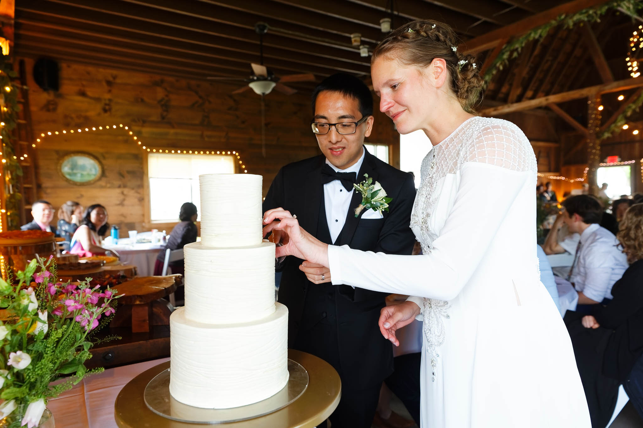 bride and groom cutting the cake