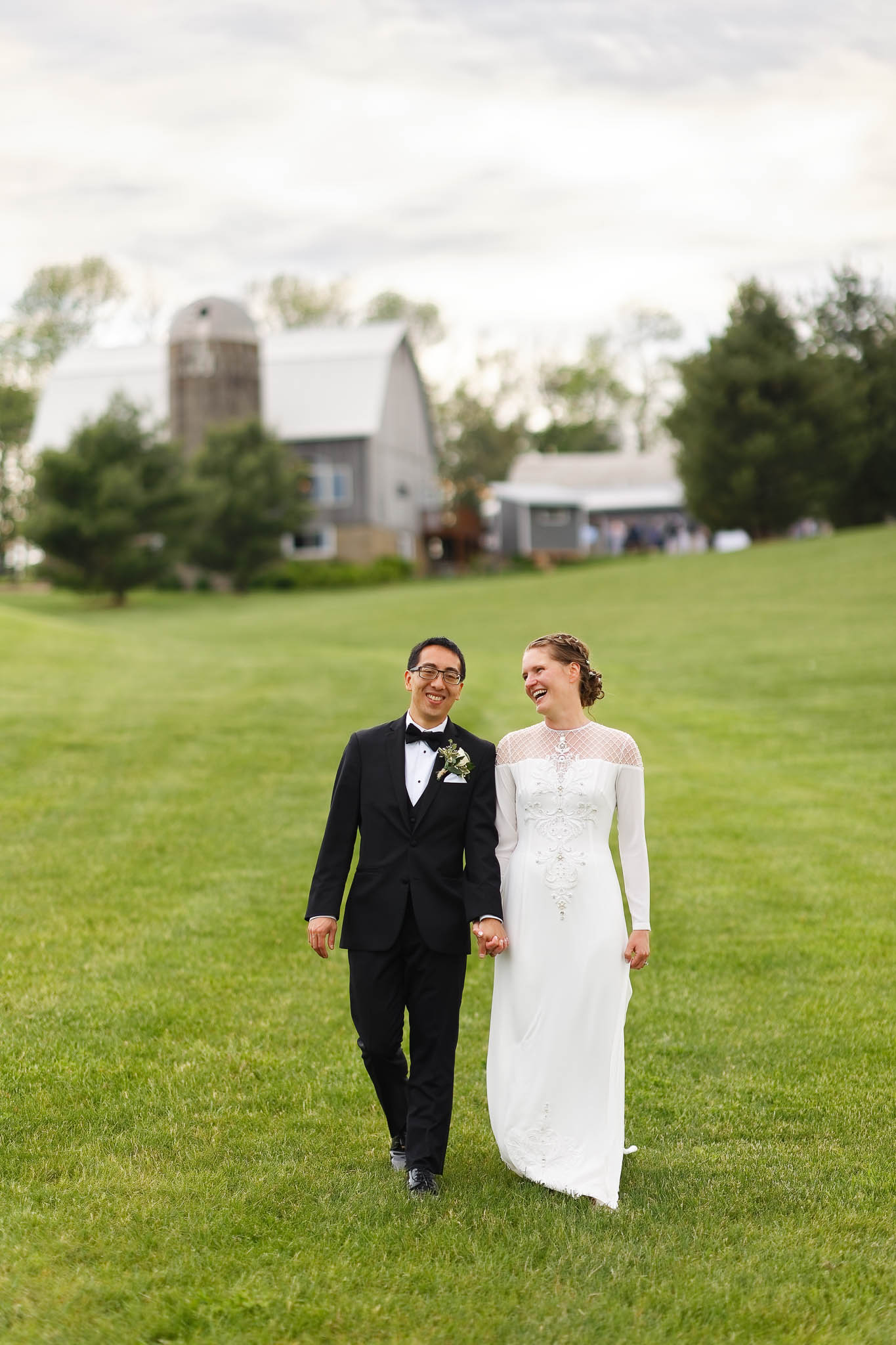 bride and groom portrait with the barn in the back
