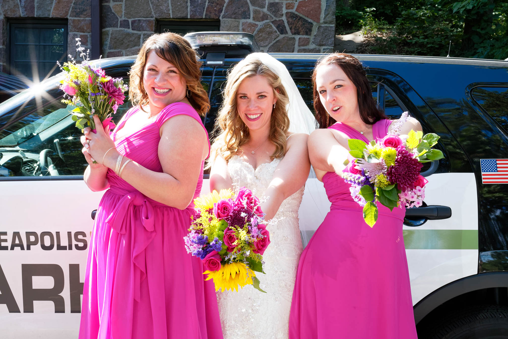 Bride Bridesmaid and police car