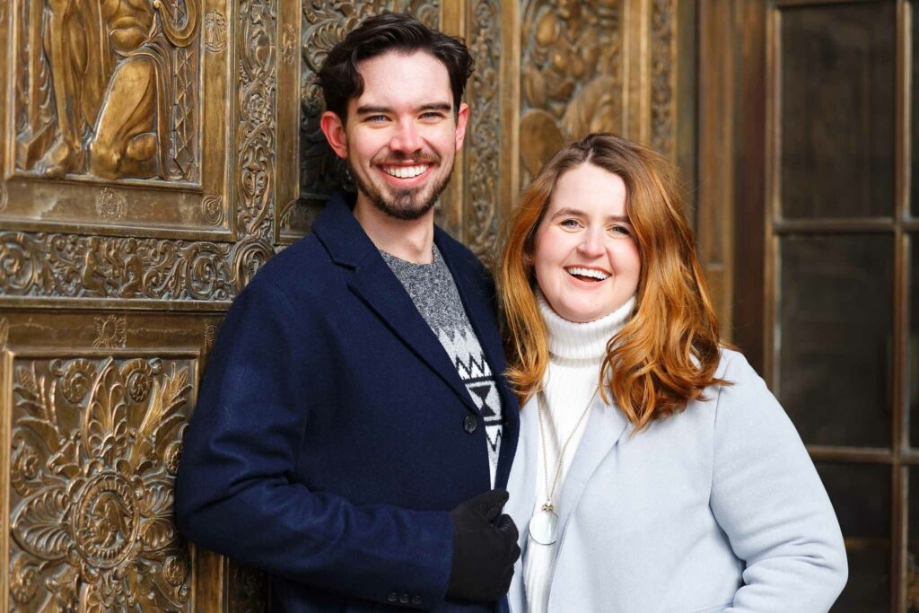 couple portrait with plummer building door