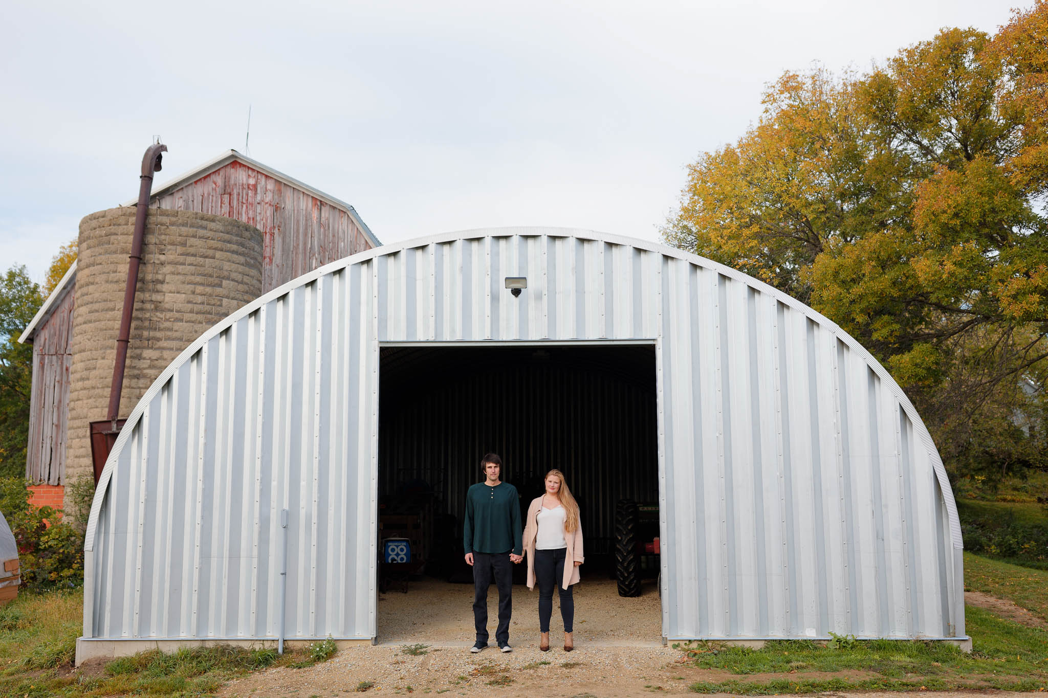 couple standing in front of The Quonset Shed
