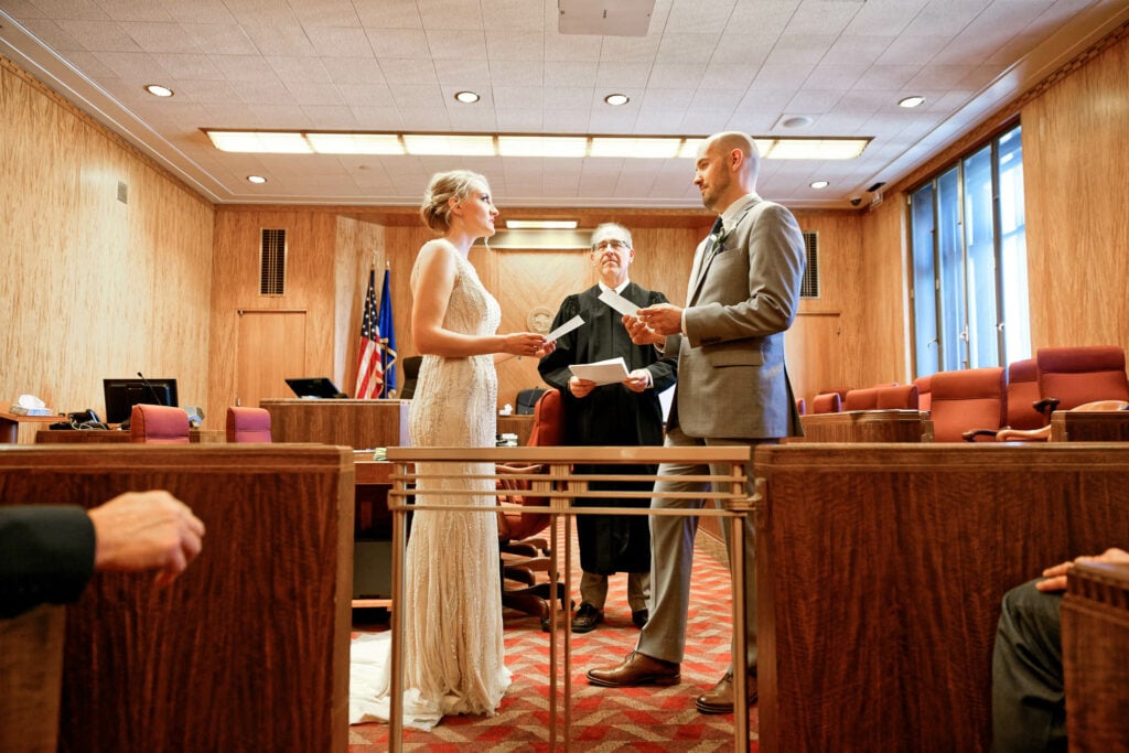 Bride and groom and the judge during courthouse civil union