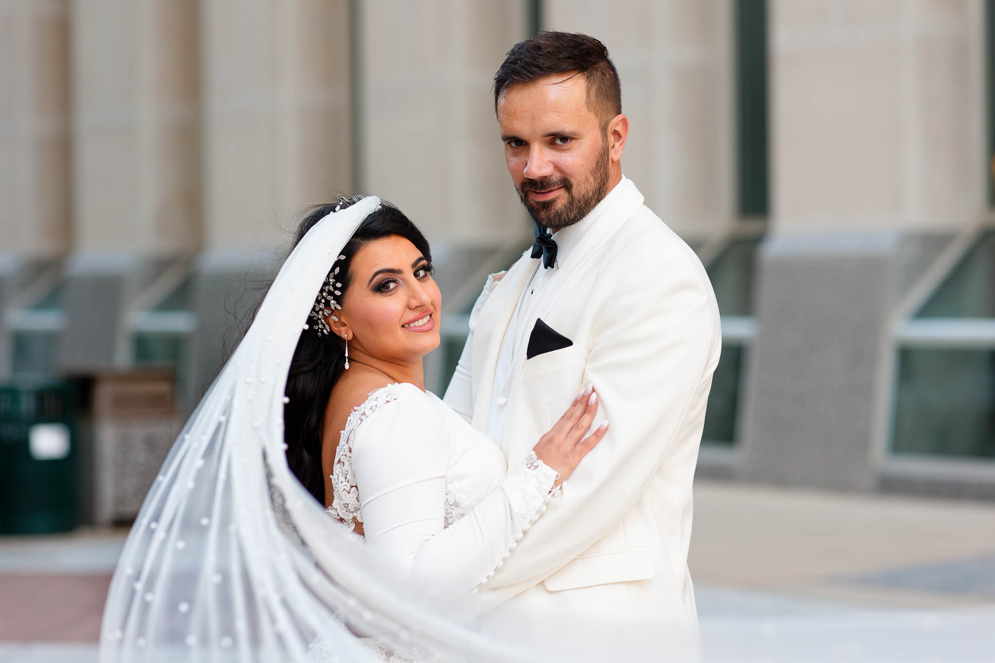 bride and groom with flying veil