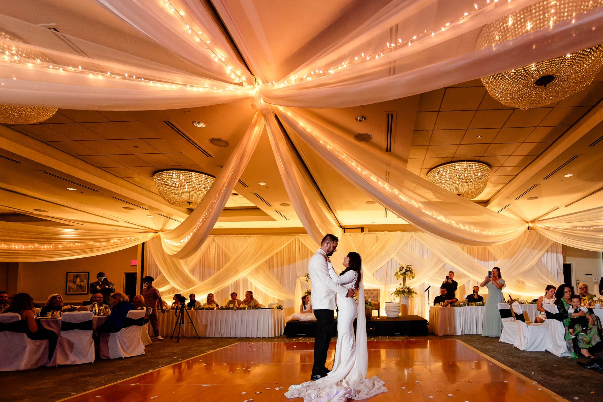 wedding reception at DoubleTree hotel ballroom with chandelier_