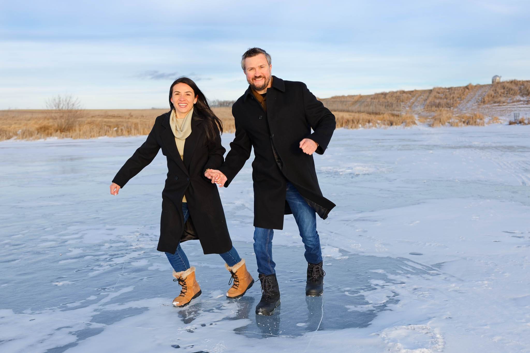 Couple ice-skating on frozen lake Rochester Mn