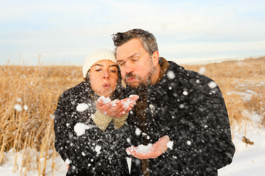 Couple playing with snow