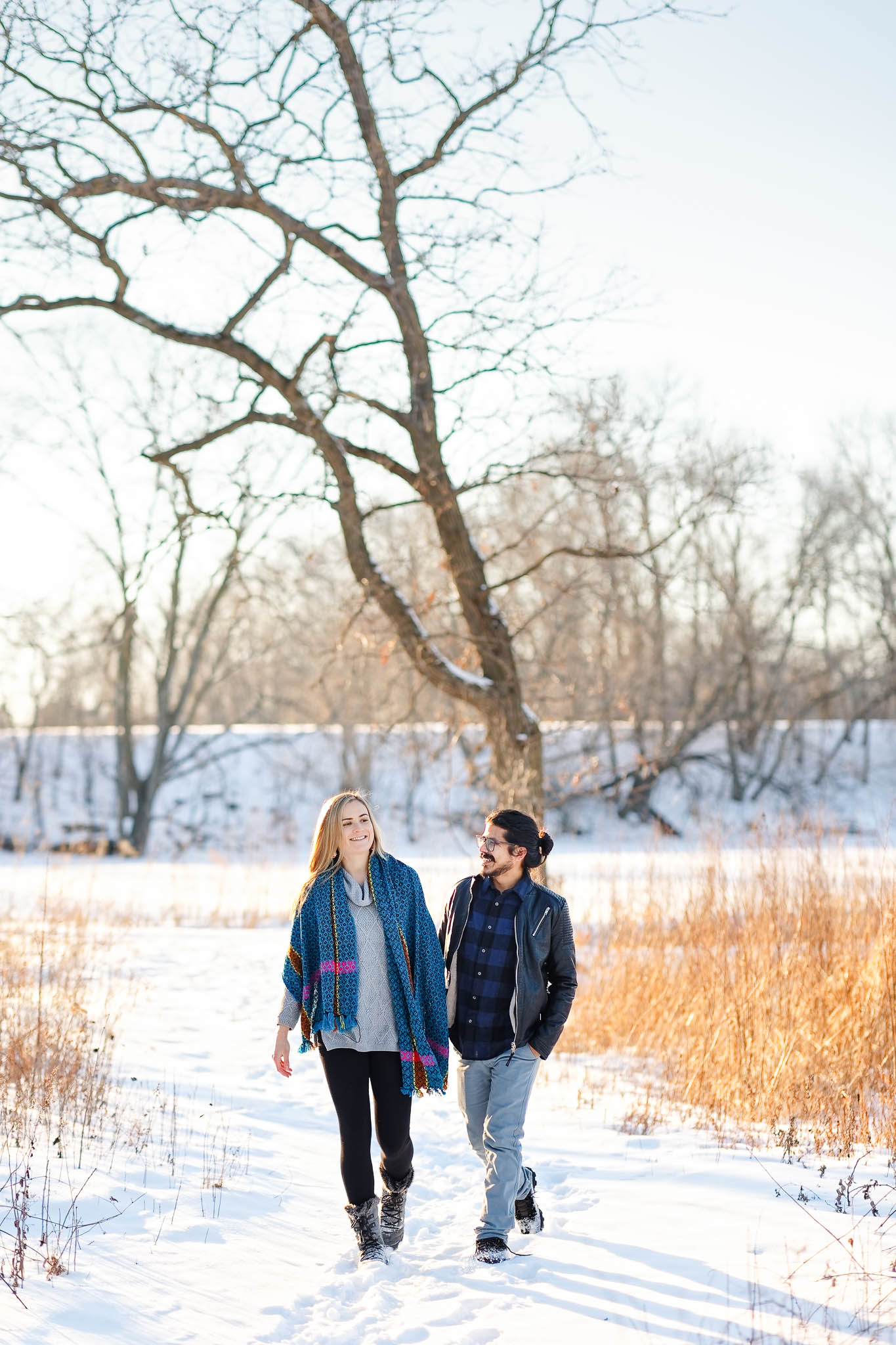 couple walking at silver lake park on white snow day-2
