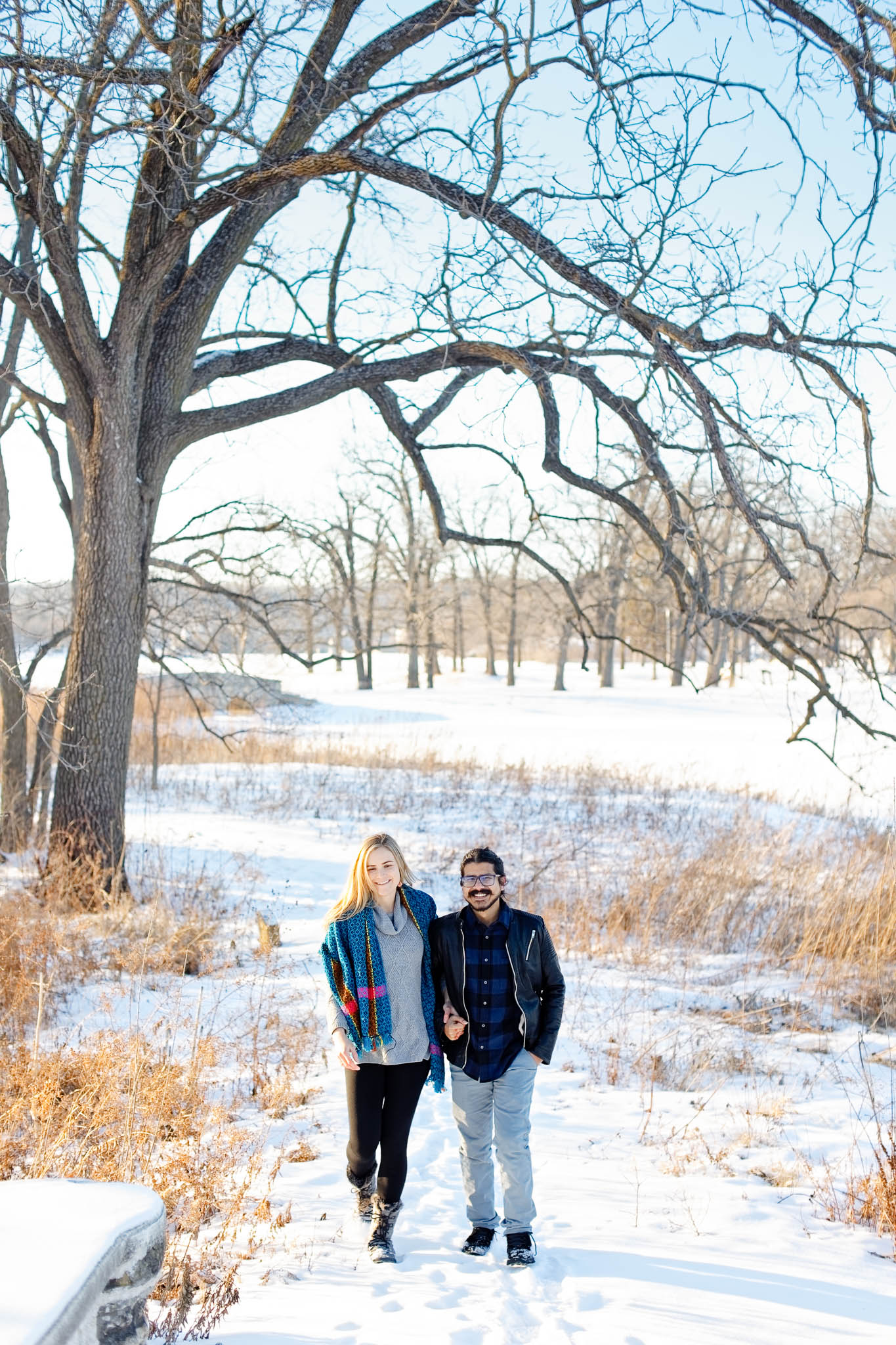 couple walking at silver lake park on white snow day