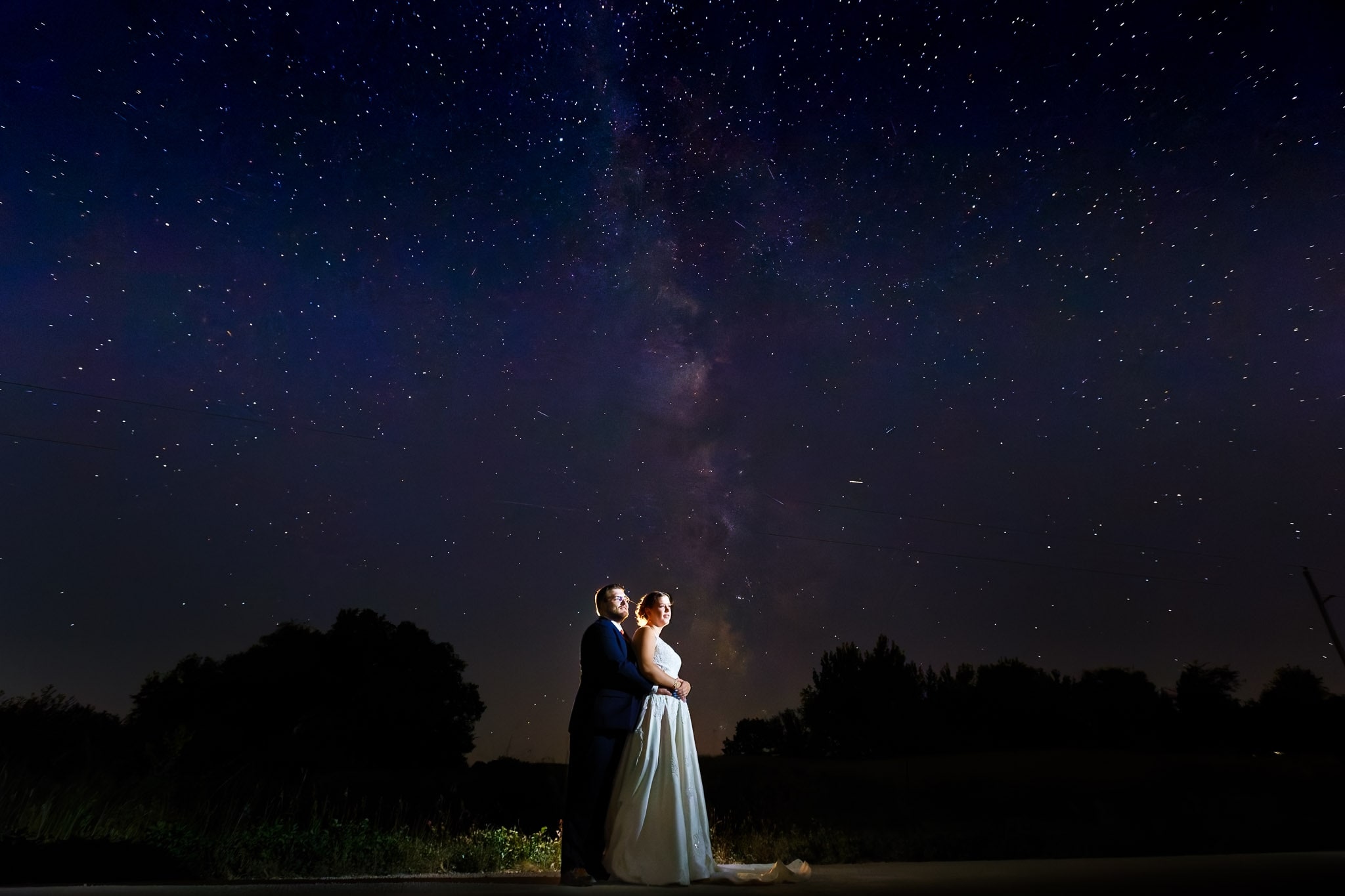 bride and groom under the stars