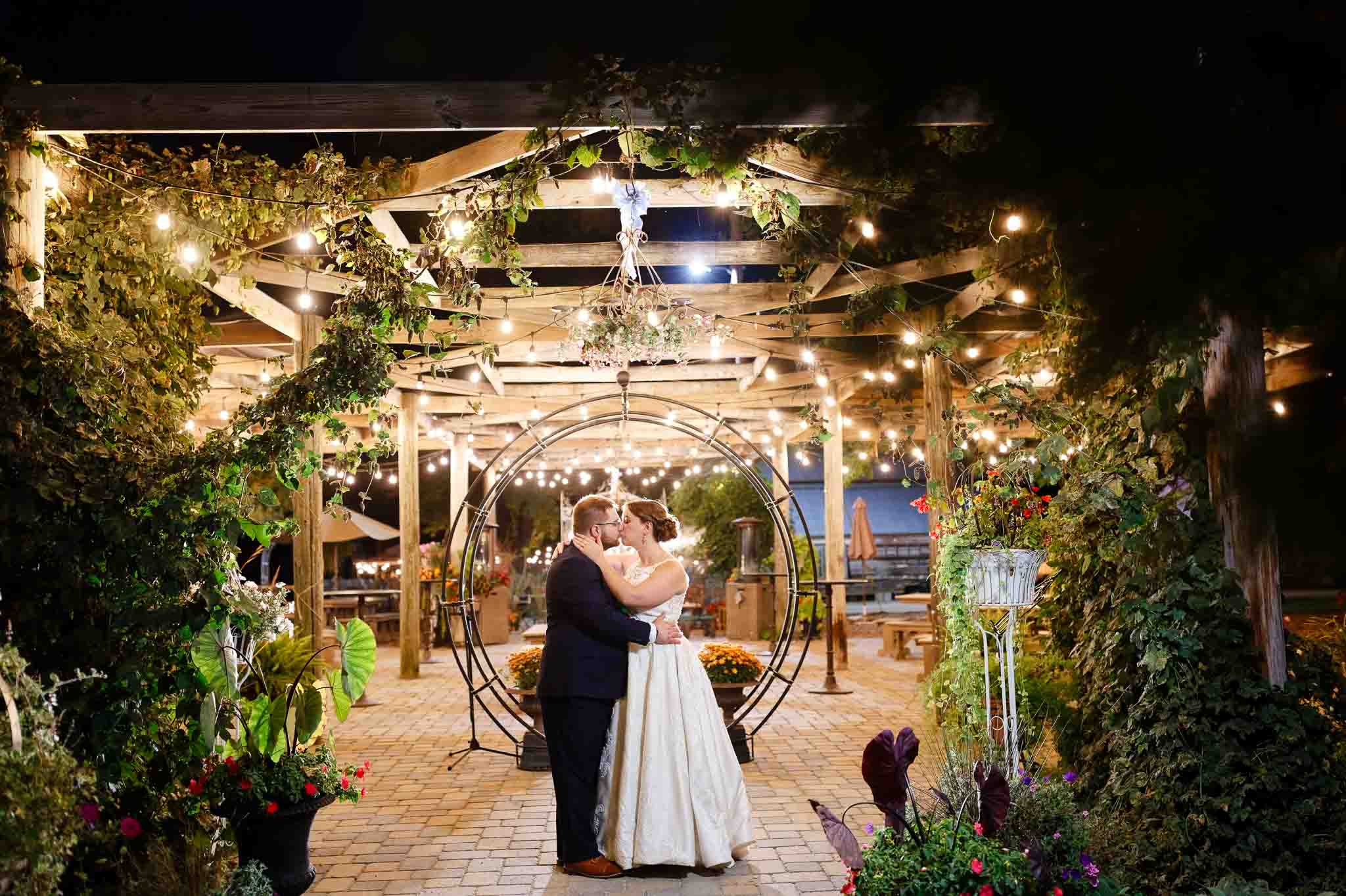 night photos couple under pergola light