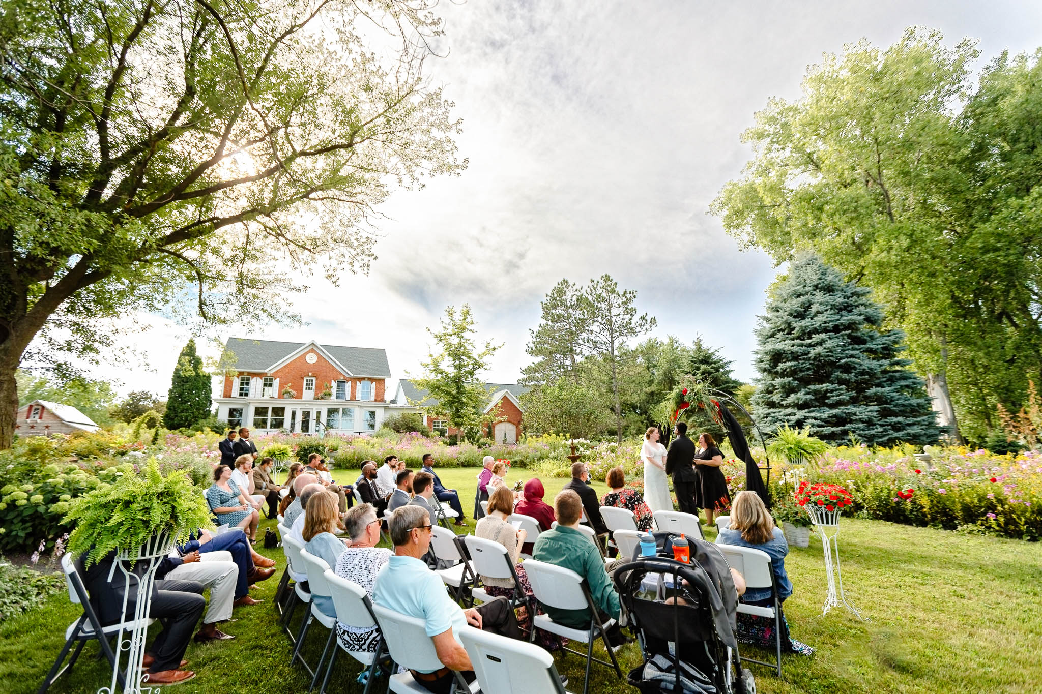 wedding ceremony on big lawn view on the farm