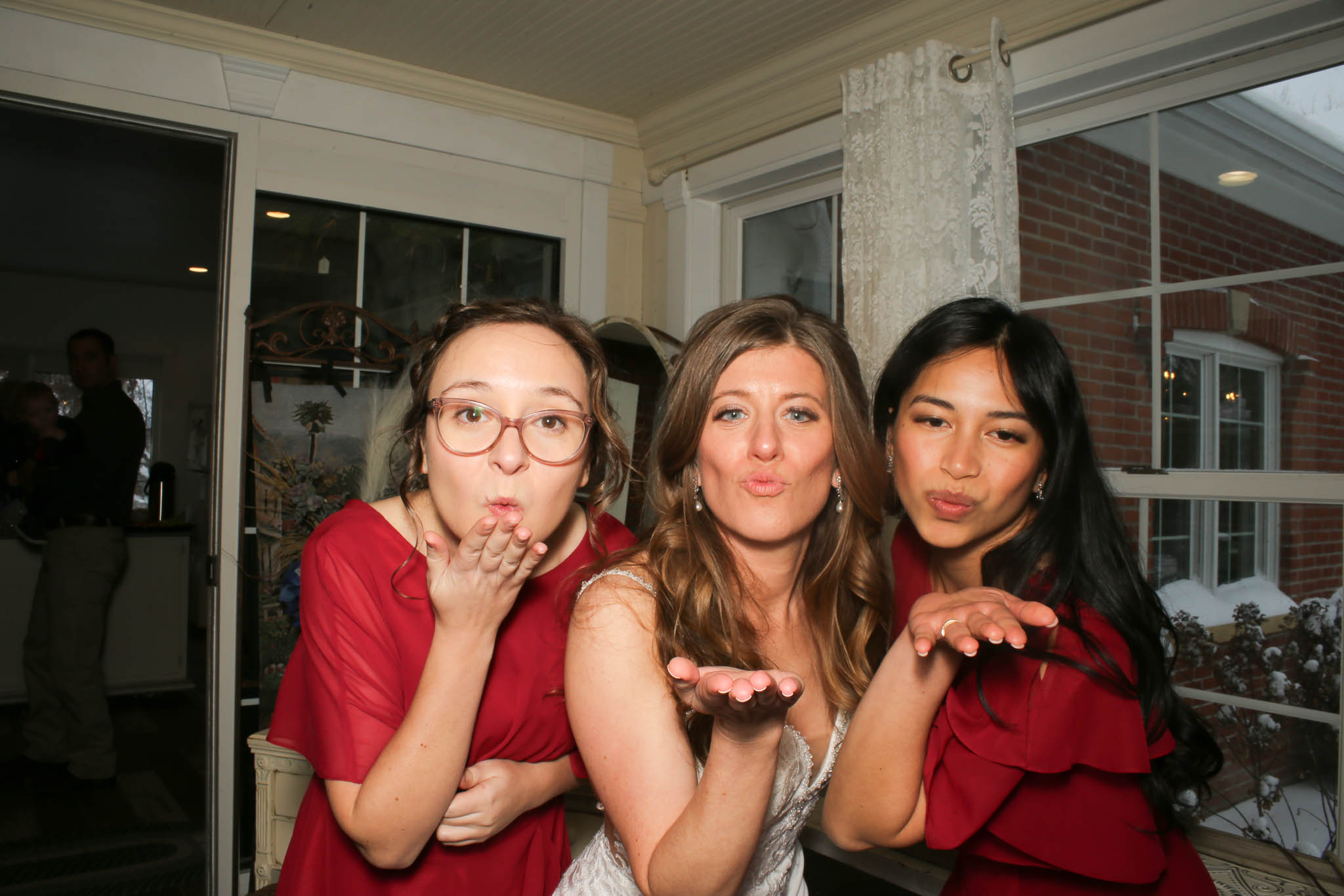 bride and bridesmaid with photo booth