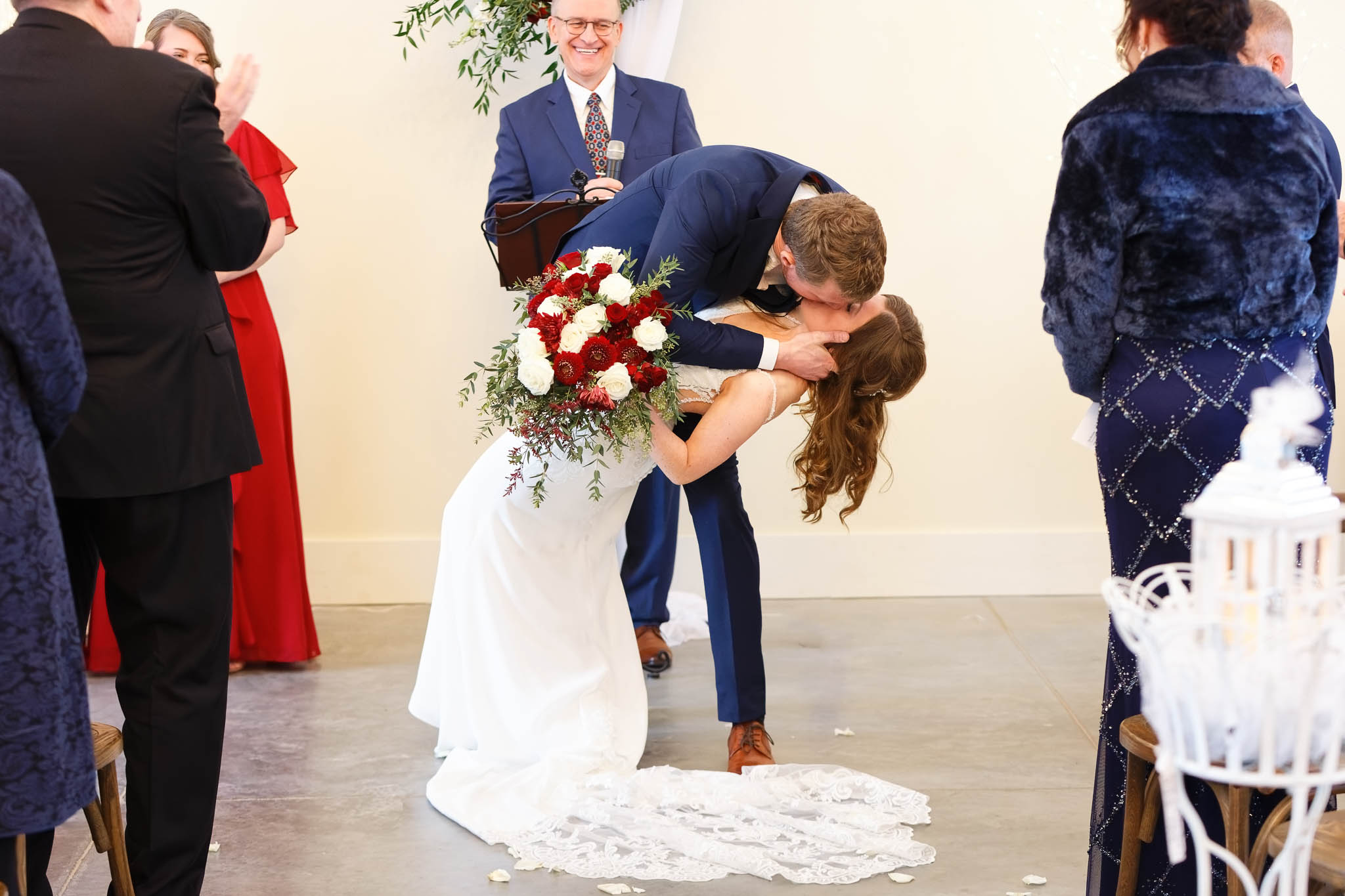 groom deeping the bride and the end of the ceremony