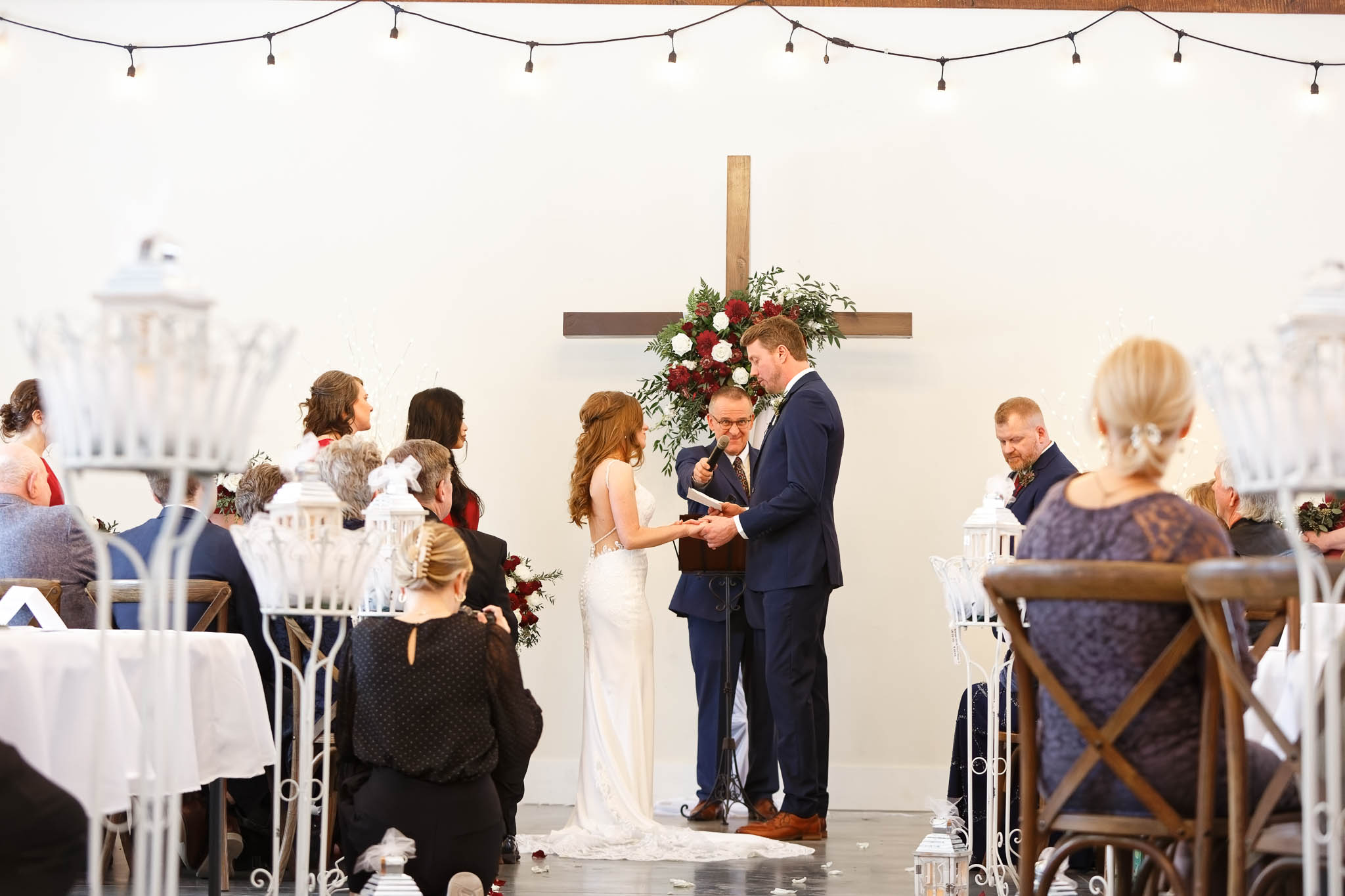 vows exchange during winter wedding at Garten Marketplatz Rochester, Mn
