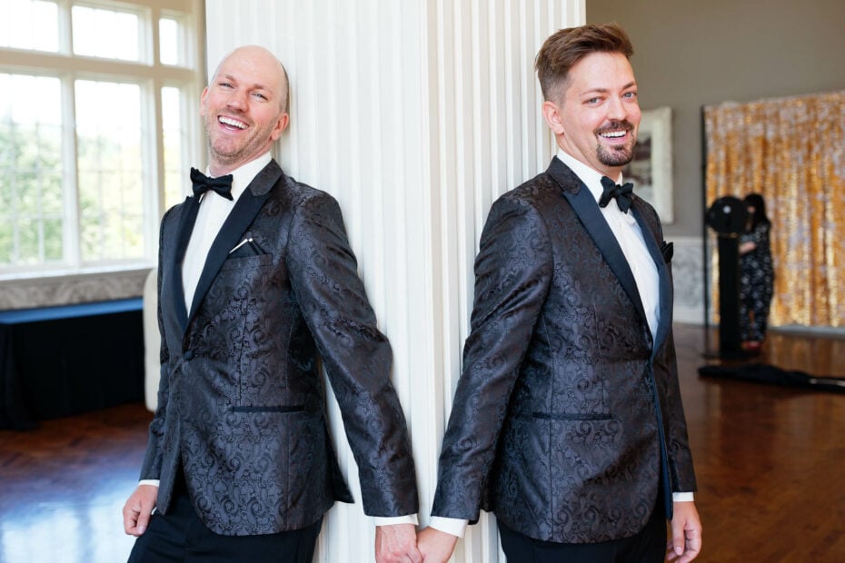 gay couple with match black tuxuedos_