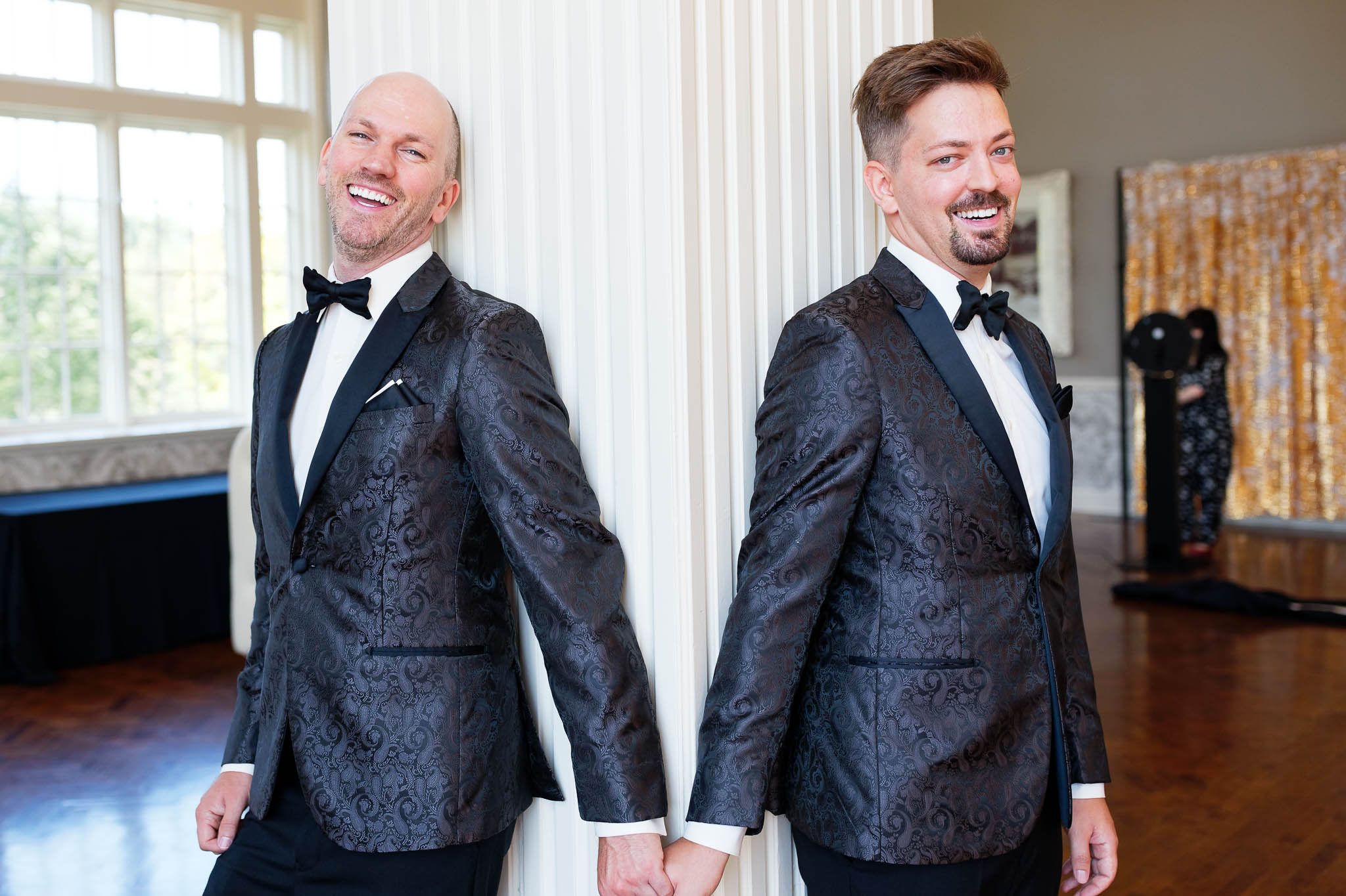 gay couple with match black tuxuedos_