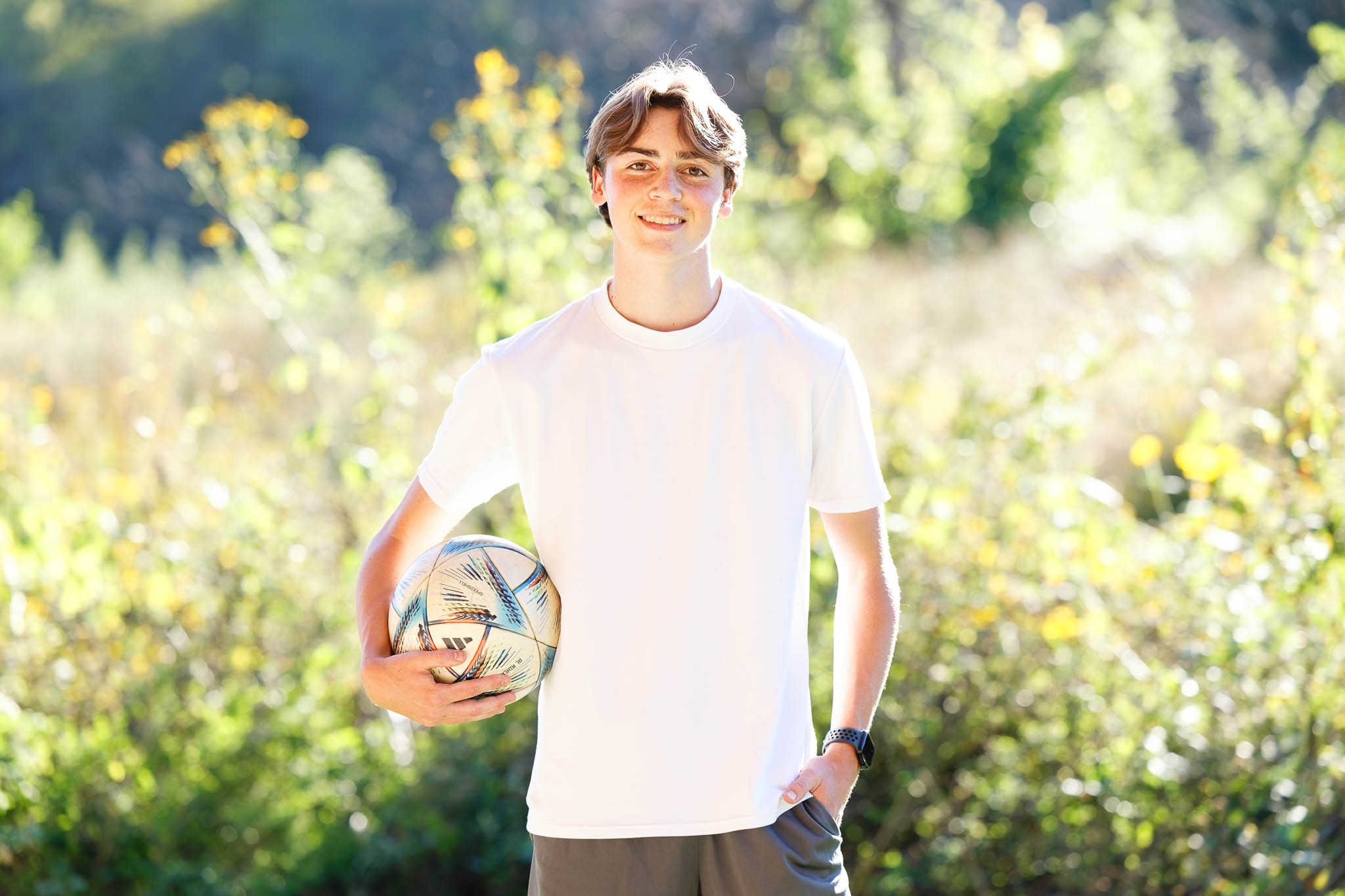 High School Senior with soccer ball