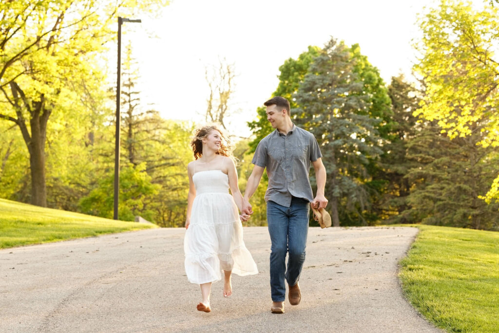 Bare foot bride running Engagement photography session at St. Mary's Park Rochester MN-4