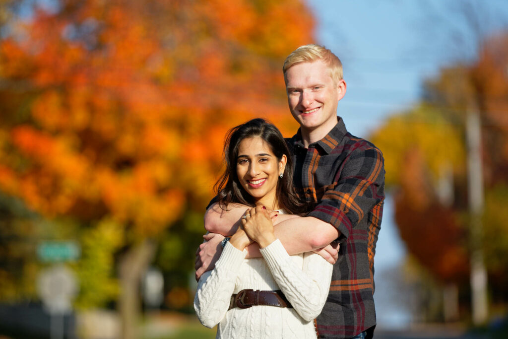 Golden hour with orange color fall engagement session orange Earthstone